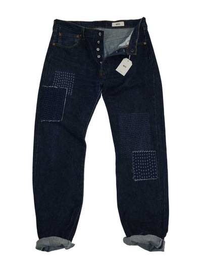 Männer Vintage Jeans dunkel blaue Waschung Größe 34/36 mit geknöpfter Frontleiste diverse Stickereien auf rechten Oberschenkel und linke Seite Knie