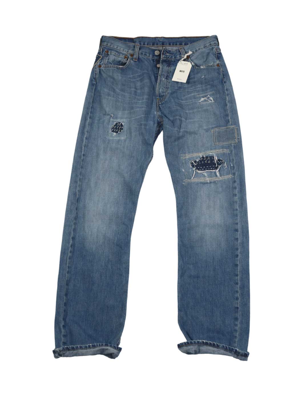 Herren Vintage Denim hellblaue Waschung Größe 30/32 mit diversen Repair Stitchings an beiden Beinen 100% Baumwolle upcycling